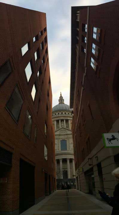 Saint Paul's Cathedral sandwiched between two high rise buildings makes an interesting photograph.