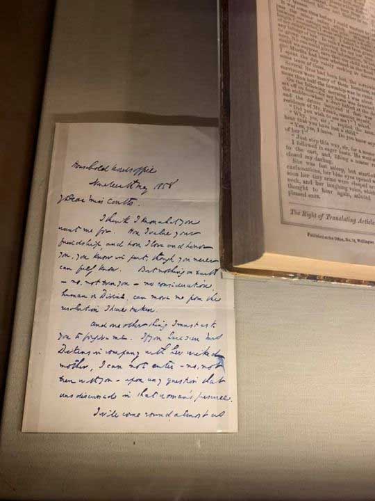 Charles Dickens' spidery handwriting in blue ink.