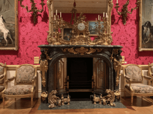 Visit Marylebone's free museum and see this amazing ornate fireplace offset by red flock wallpaper.