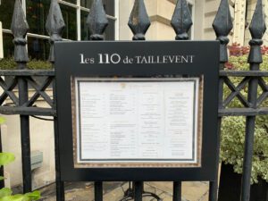 The Les 110 Taillevent lunch menu displayed outside on its iron railings.